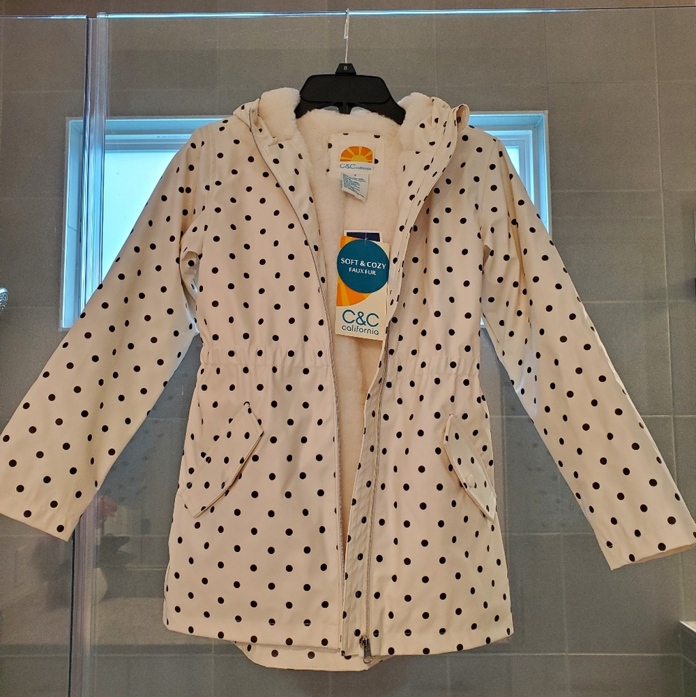 Brand New Girls Faux Fur hooded rain coat, size 8. White with black Polk a dots